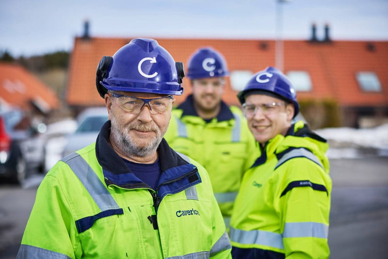 three-employees-wearing-blue-helmets.jpg